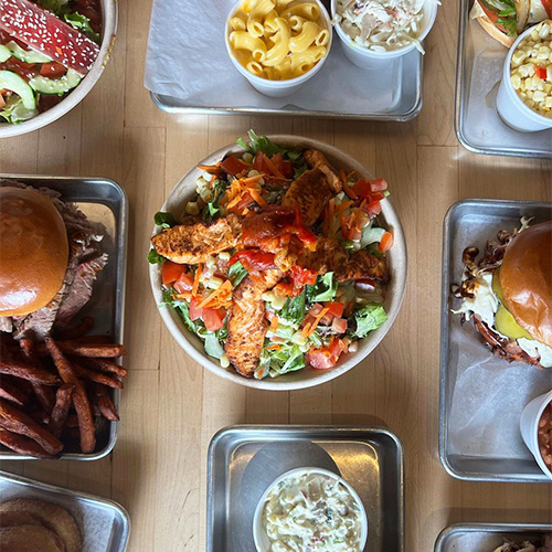 A table covered with a number of our Westlake Village BBQ food deals.