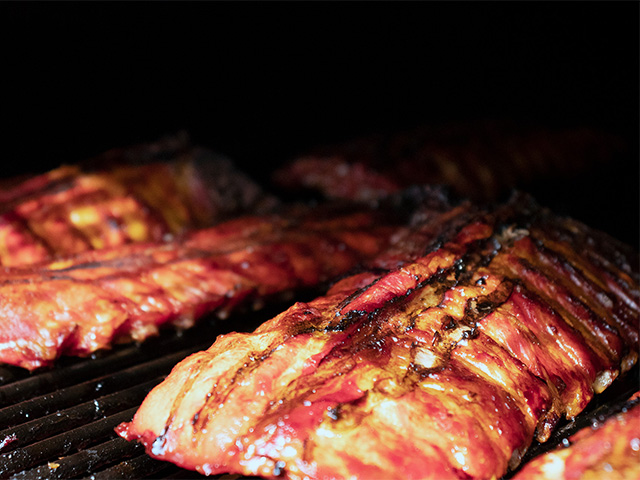 Newbury Park holiday food caterers serving BBQ meat for seasonal event.